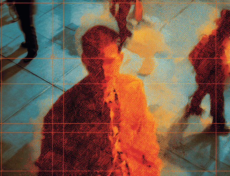 a man in a suit and tie is standing in front of a group of people