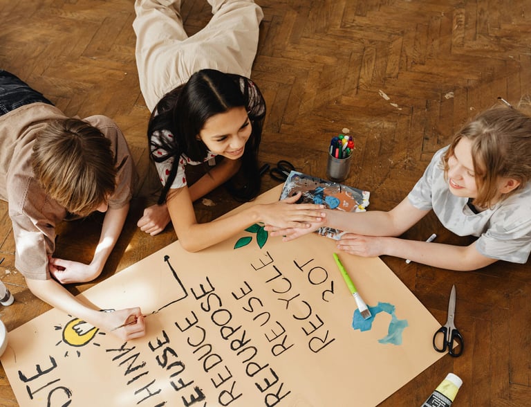 Photo by Photo By: Kaboompics.com: https://www.pexels.com/photo/friends-painting-on-brown-paper-7692