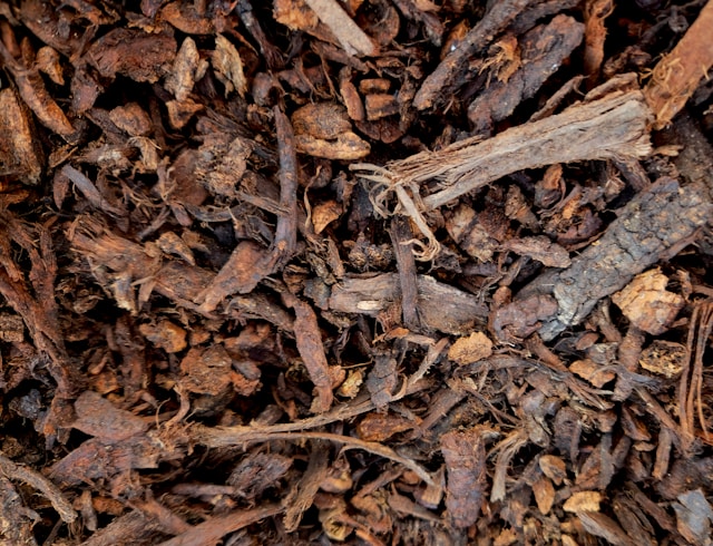 a bunch of mulch used and spread in a garden