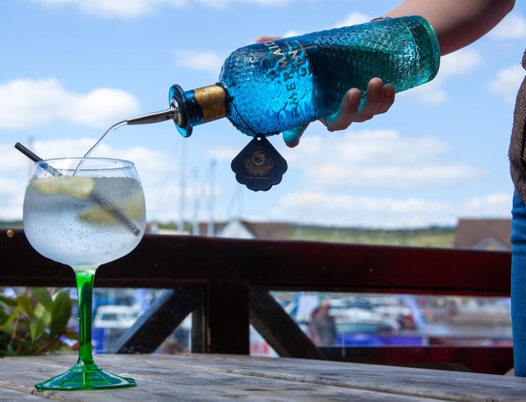 Mermaid Gin being pored into a glass