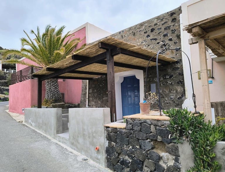 Dammuso in Cala Levante near Elephant Arch, surrounded by Mediterranean landscape