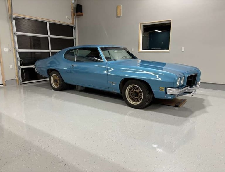 Classic car parked on finished epoxy garage floor installed by Premium Garage Floors