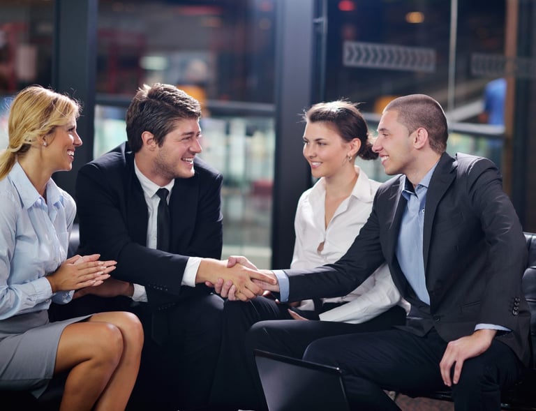 partners shaking hands with smile