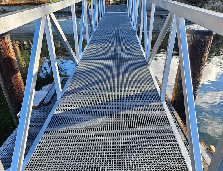Commercial Marina Dock Gangway with FRP mesh installed.