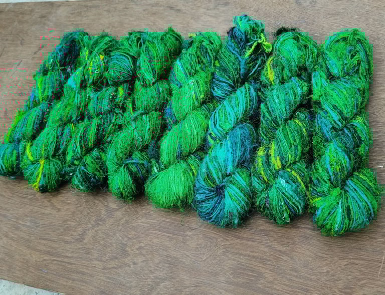 this is fine quality of recycled sari silk yarn. 125 meters of yarn in a 100 gram of skein.
