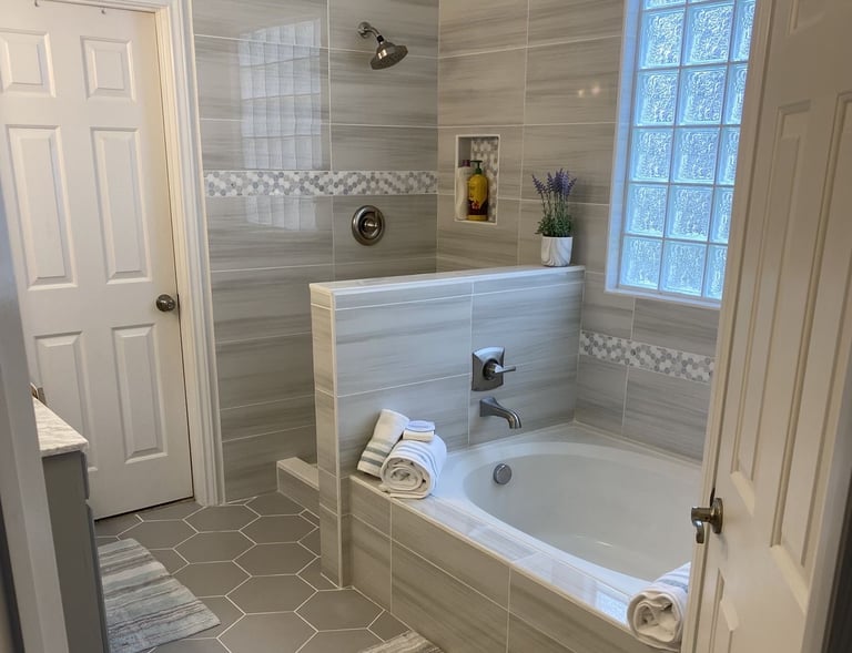 Sparkling clean bathroom with bathtub, towels, and tile finish – SparkEaseCleaning premium bathroom 