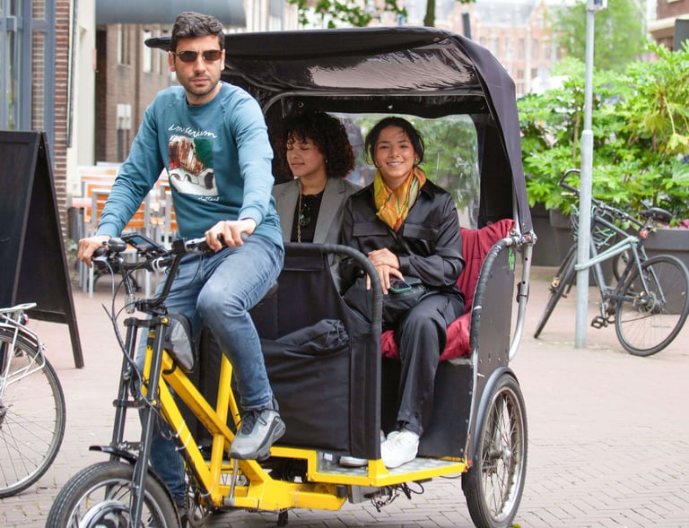 young latino ladies on bike taxi ride
