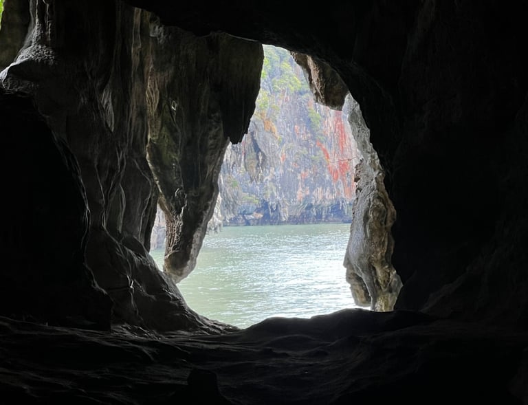 a hole at the end of a cave looks out at the Andaman Sea