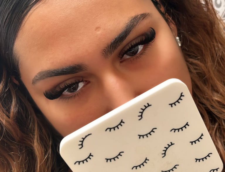 alt="mobile lash technician applying lashes in London home"