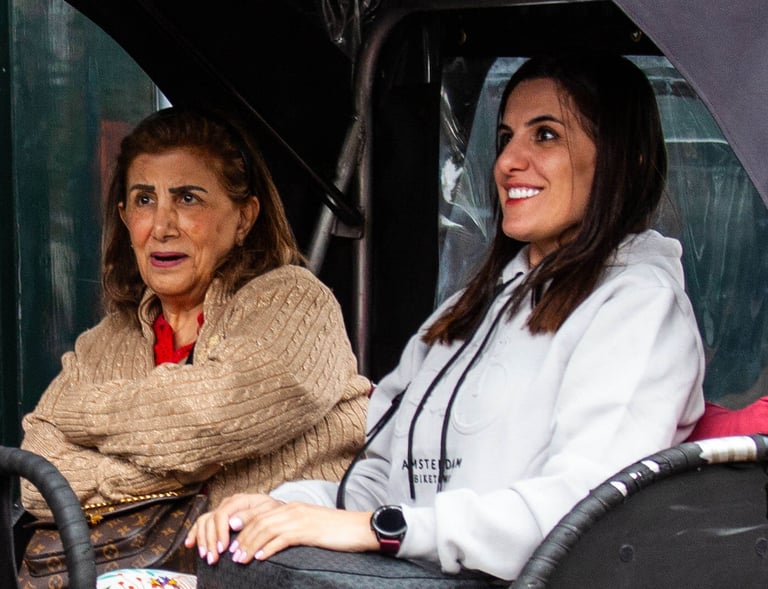 mother and daughter from oman on bike taxi