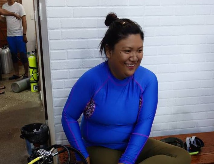 a woman in a blue shirt and a man in a blue shirt