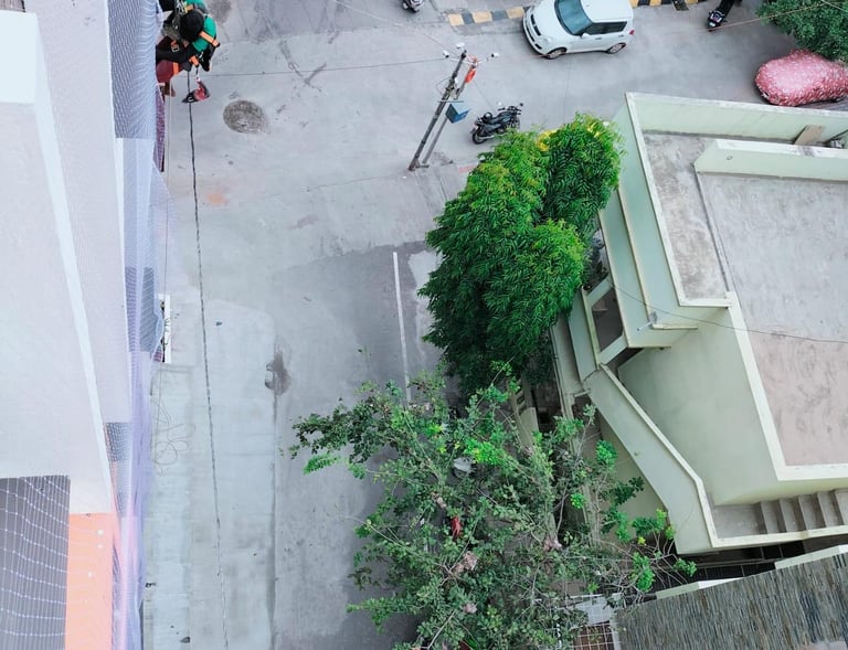 Safety net installation in progress with tools and materials neatly arranged on site.