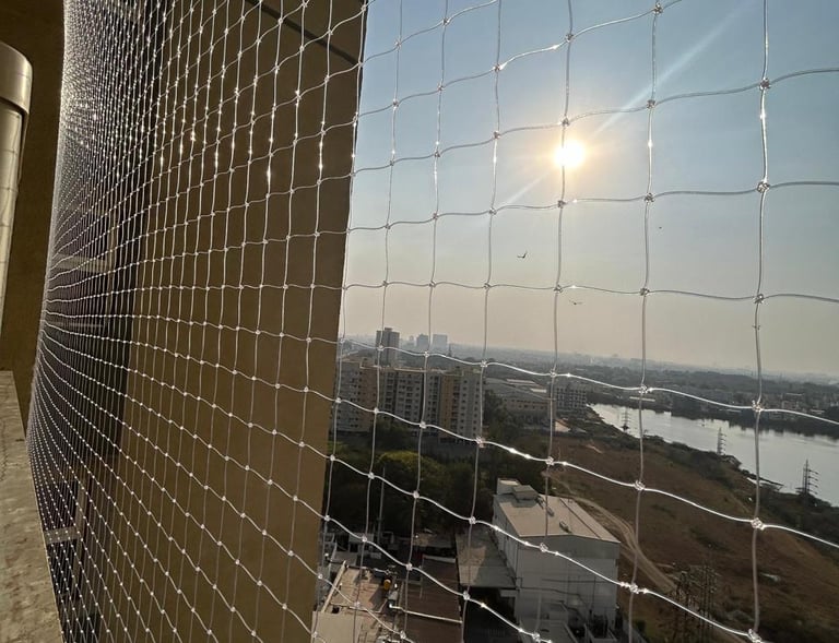 Close-up of a sturdy balcony safety net installed on a high-rise apartment in T Nagar.