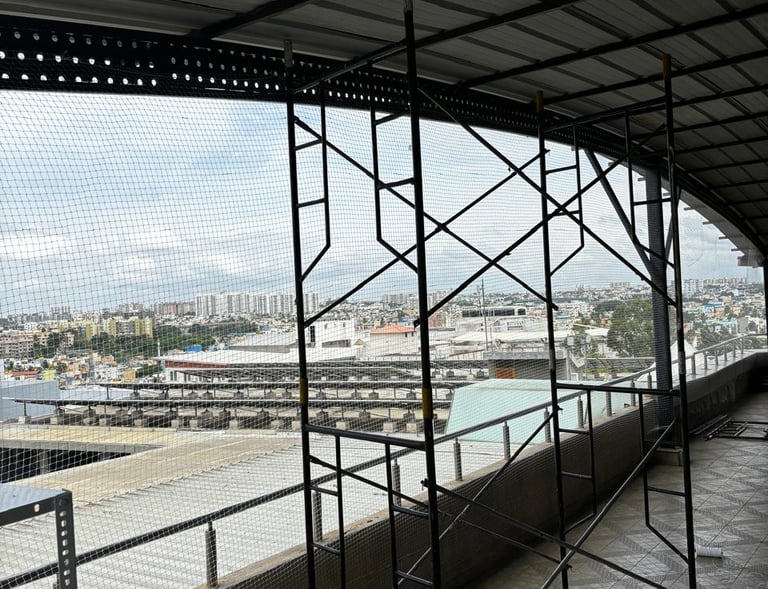 Evening shot of a balcony with pigeon netting, highlighting the clean and neat installation work.