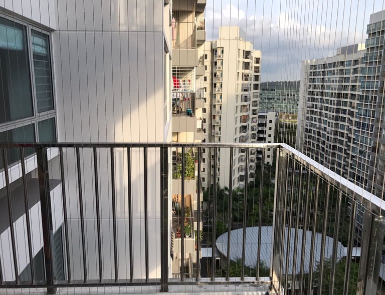 Installation process snapshot showing Arjilli Enterprises technicians fitting invisible grills on a