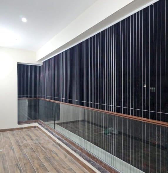 Close-up of a sleek invisible grill installed on a balcony in Mylapore,chennai