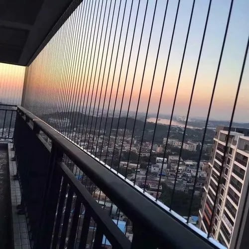 Installation process of invisible grills by Arjilli Enterprises technicians fitting in t nagar