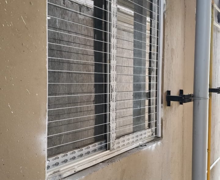 Evening shot of a balcony protected by invisible grills, in T nagar