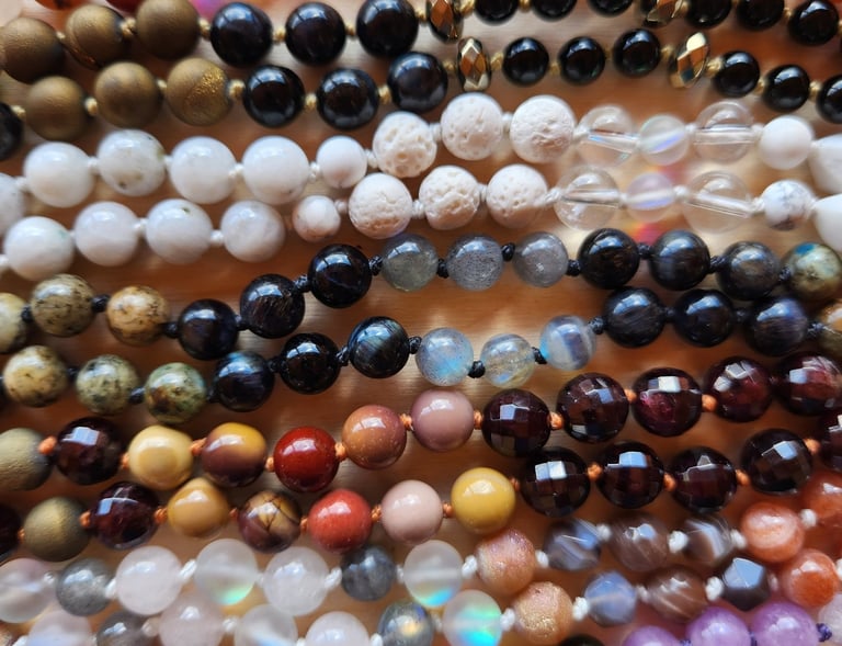 Hand-knotted gemstone mala necklace with 108 beads, created by Tina Medina for spiritual meditation and energy healing