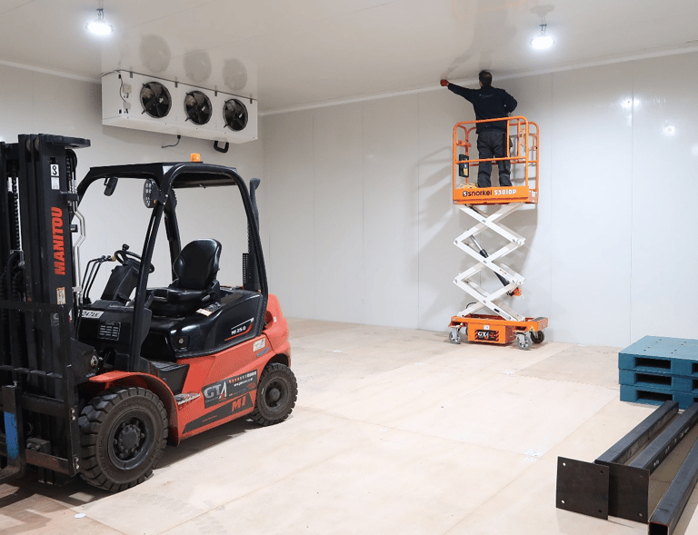 Installation team in the freezer room in London