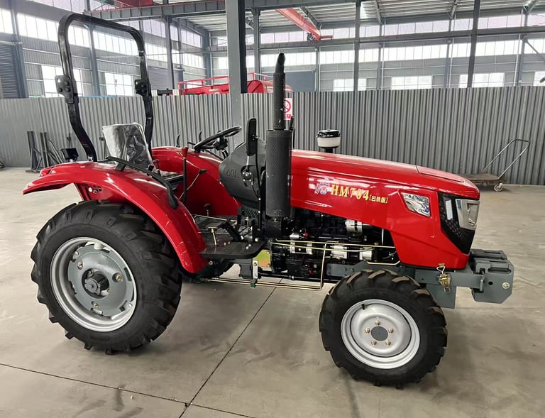 a 70HP/4WD red tractor with a large wheel on it