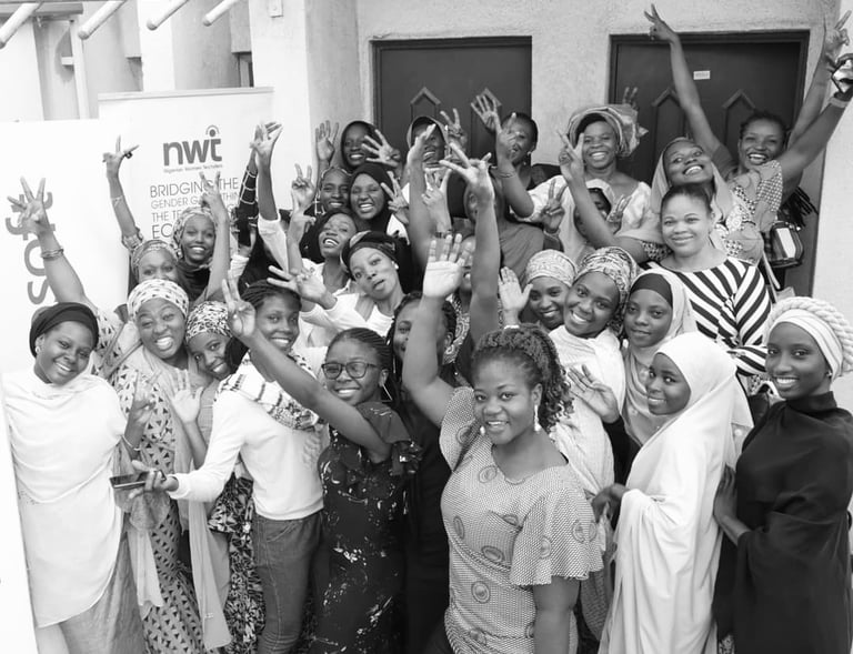 a group of women standing around a table