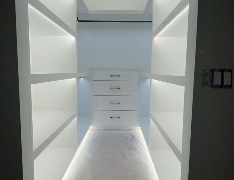 Custom made closet with plenty of drawers and hanging space- Britto's Home Improvement