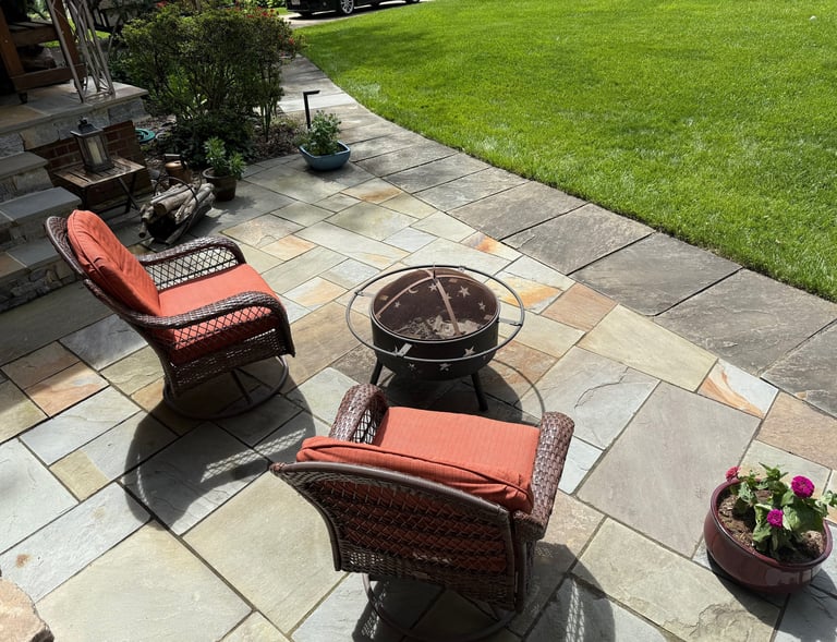 Spacious front patio with colorful natural stone in a random pattern
