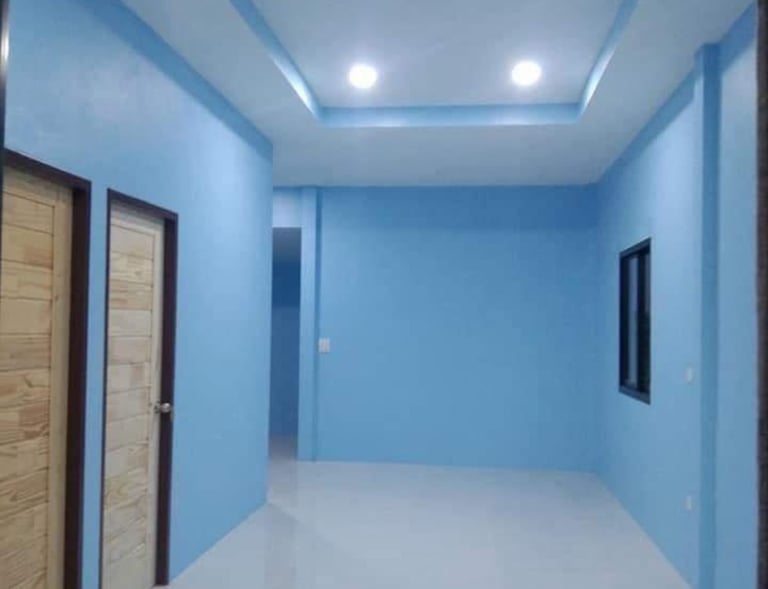 Finished hallway with painted walls and drywall ceiling with recessed lighting by Garnet Painting & Remodeling GA