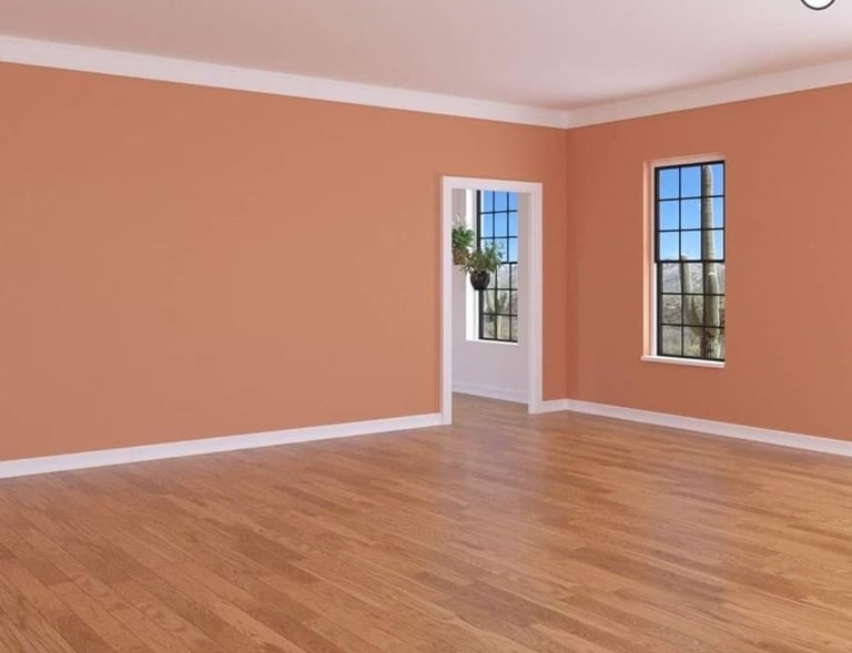 The interior of a room transformed with fine interior carpentry, paint, and new flooring.