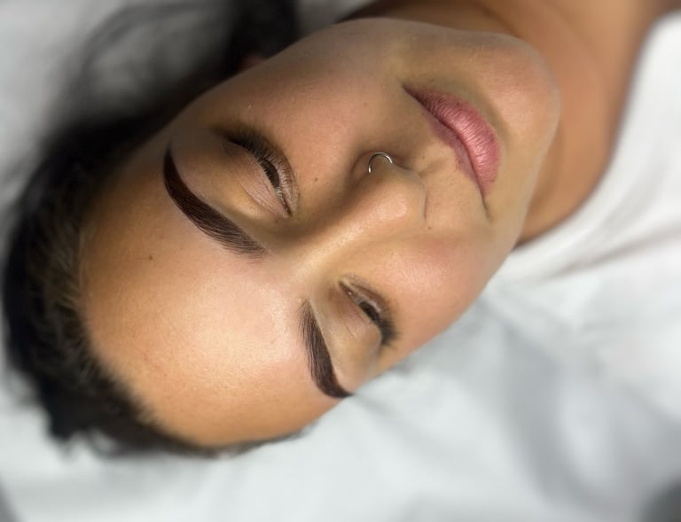 a woman is laying down on a bed