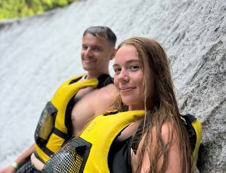 a man and woman in life jackets and life jackets