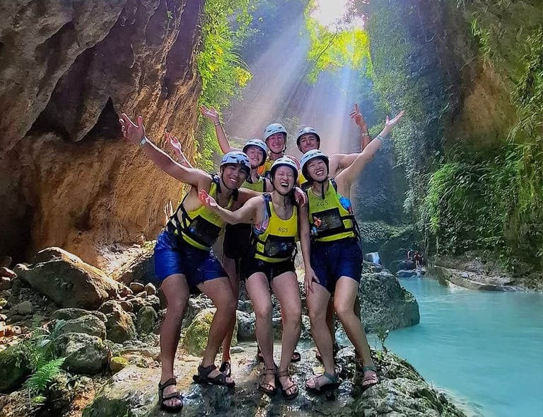 a group of people standing on a rock formation