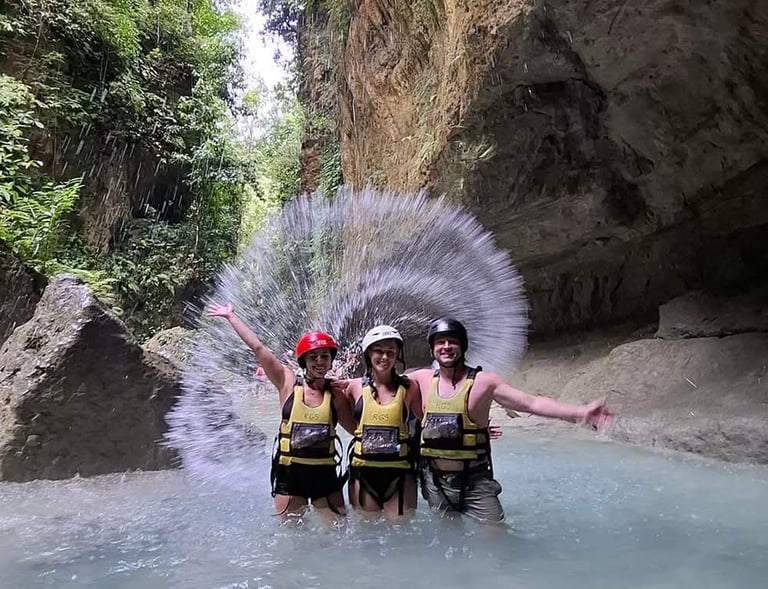 a group of people standing in a river