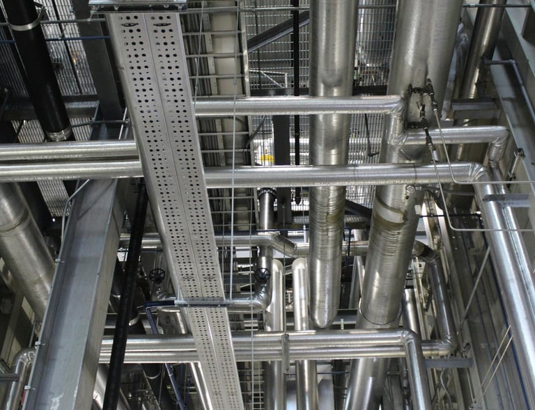 a large metal pipework in a large room