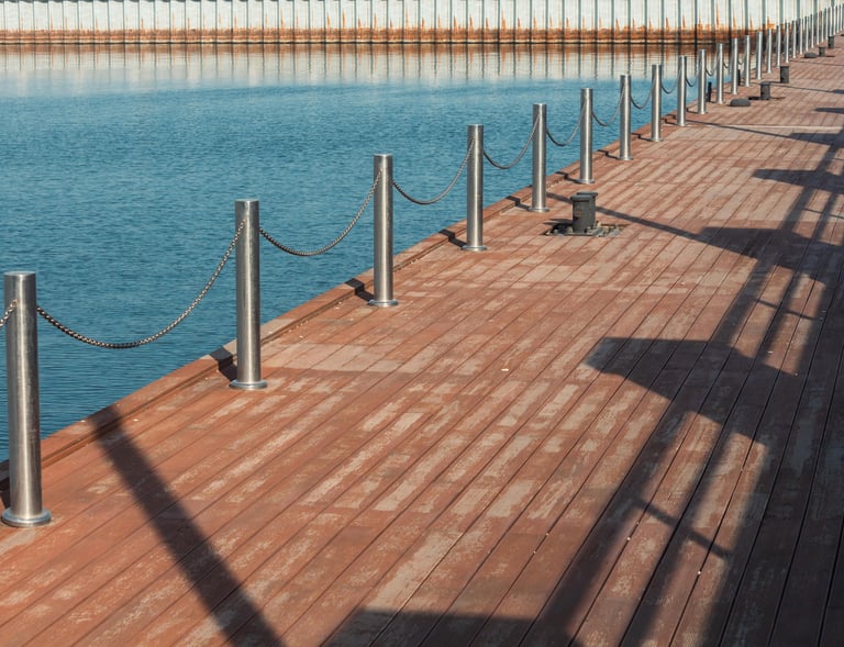 a wooden deck with a metal fence