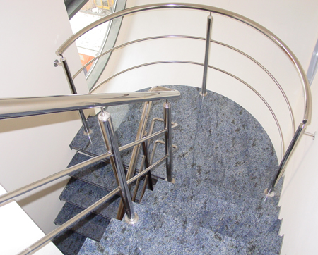 a spiral staircase with a metal railing