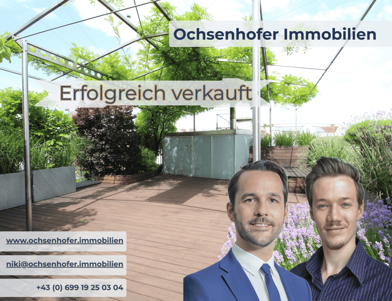 Two real estate agents from Ochsenhofer Immobilien standing before a successfully sold rooftop terrace.