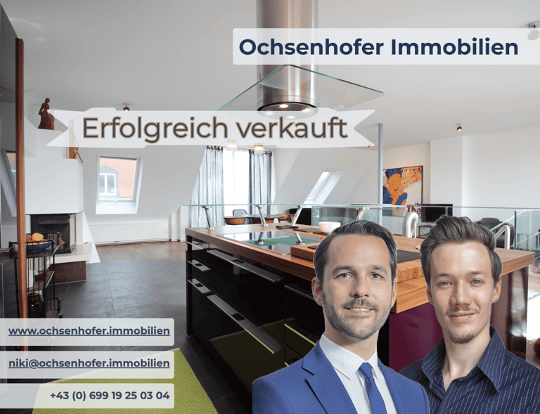 Ochsenhofer Immobilien real estate agents shown in a modern luxury kitchen after a successful sale.