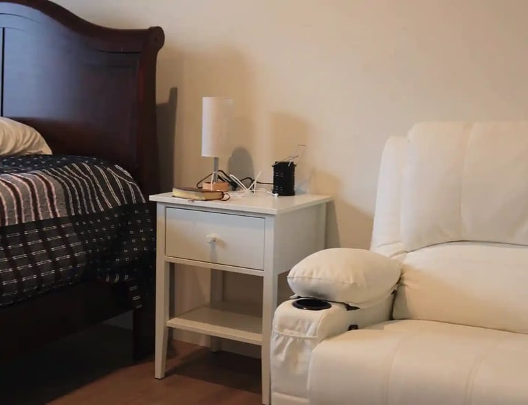 Comfortable bed in adult family home bedroom with clean linens and pillows for resident comfort.