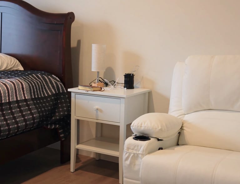 Comfortable bed in adult family home bedroom with clean linens and pillows for resident comfort.