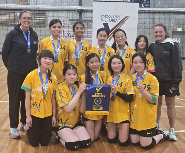 Ayesha celebrating with her volleyball team after winning the state championship.