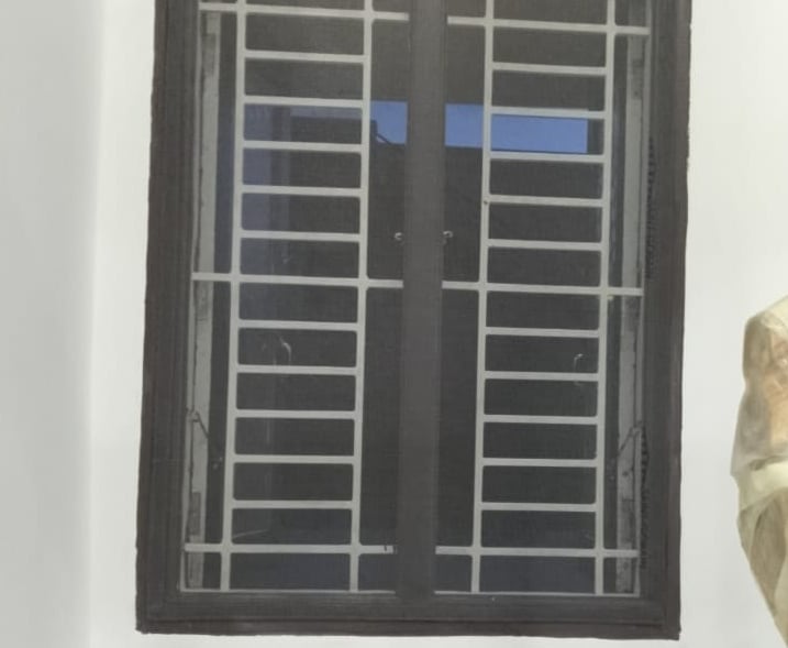 A clean and secure mosquito net installed on a washroom window, showcasing neat edges and tight mesh