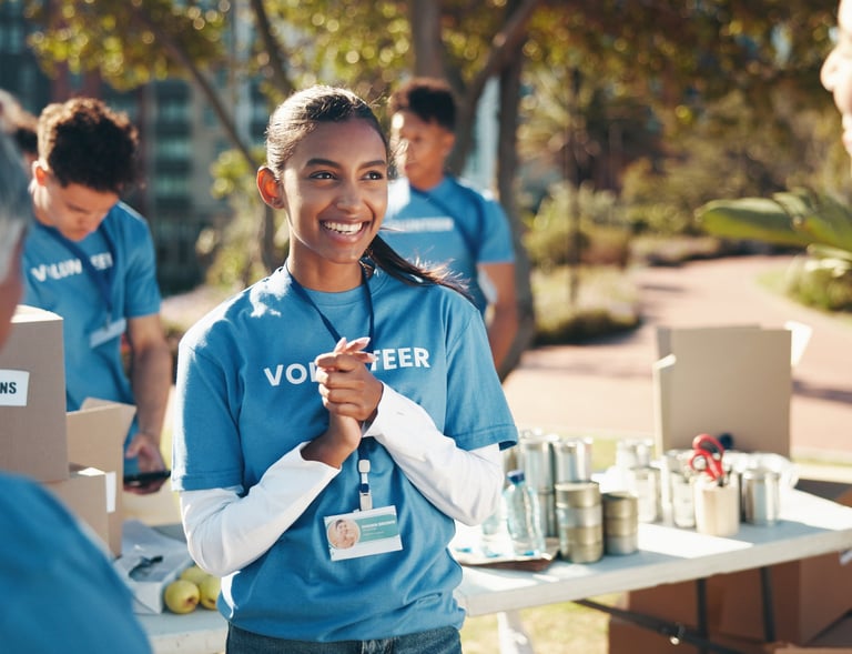An image of a group of young teens volunteering in an event