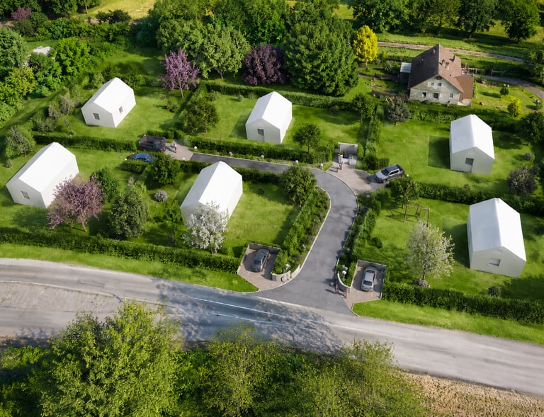 Vue en perspective du lotissement Le Clos du Pressoir avec ses terrains à bâtir, ses aménagements pa