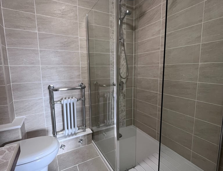 recently renovated bathroom with walk-in shower
