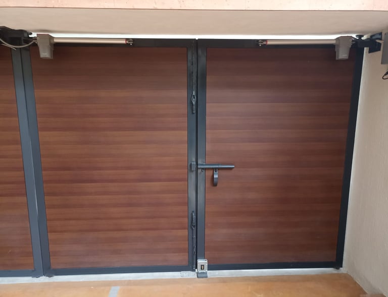 a pair of doors with a wooden door and a door with a window