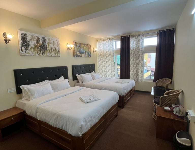 A charming hotel building situated on the bustling Darjeeling Mall Road near Chowrasta Mall