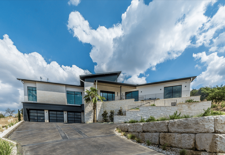 a house with a driveway and a driveway with a driveway