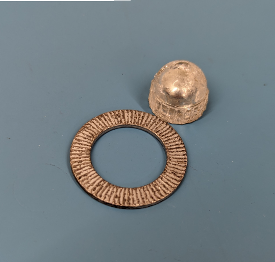a metal object with a ring on it